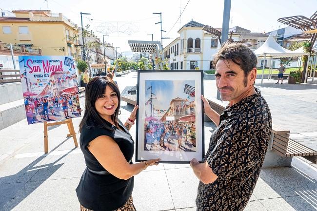 La alcaldesa de Armilla y el autor del cartel.