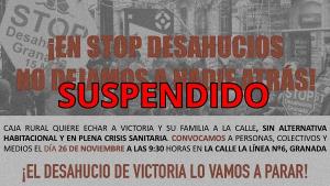 Cartel informando de la suspensión del desahucio.